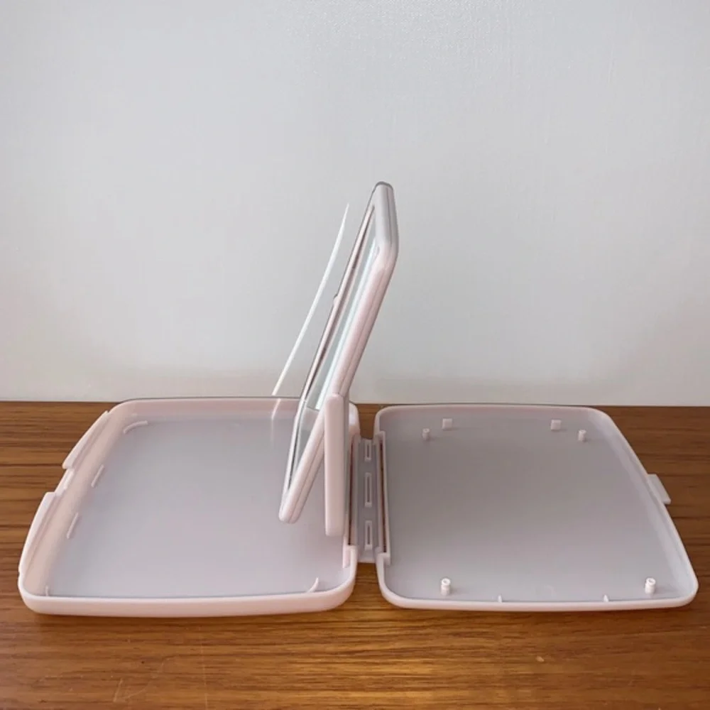 Mary Kay pink plastic compact travel mirror.